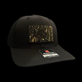 Richardson 112 Black Bigfoot Camo Performance Trucker Hat